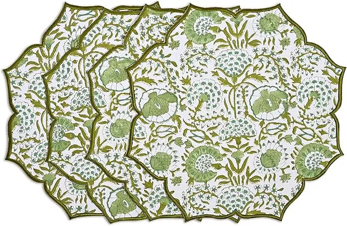 Set of floral patterned placemats with green and white design on a white background